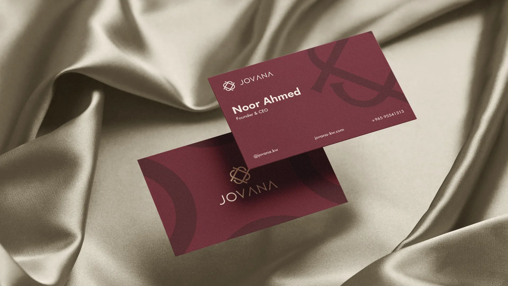 Jovana burgundy business cards on cream satin